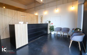 Apex reception desk custom made in Polytec Natural Oak with Black.