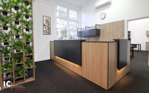 Custom made reception desk to suit two operators 3700L x 2700L. LEF feature lights and rear storage.