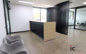 Custom made reception desk with feature curve slat wall behind. Many colour choices.